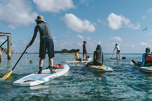 Paddling on Tobacco Caye Belize