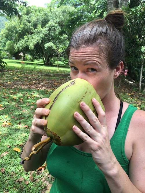 Drinking from a fresh coconut at Bocawina Rainforest Resort, Belize