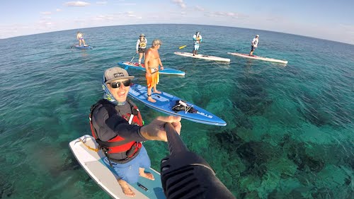 Norm teaching a Belize SUP Skills Camo