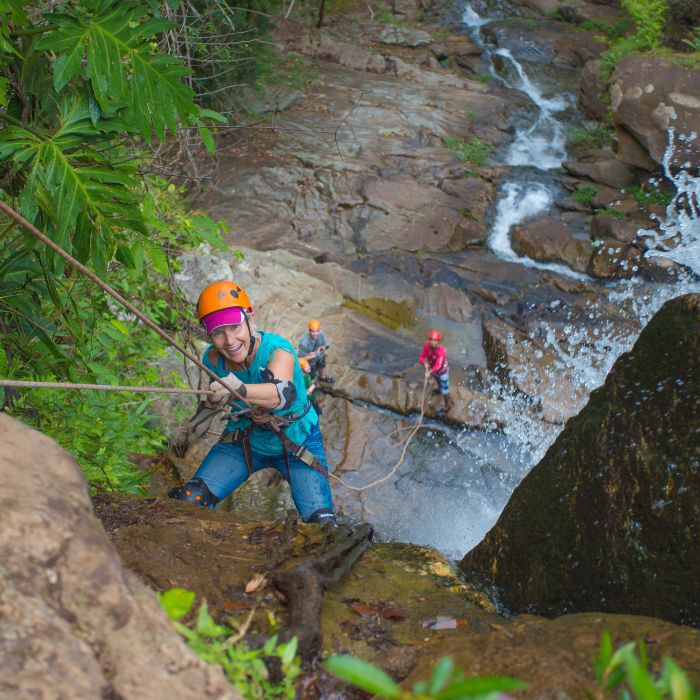 Rappelling down a waterfall