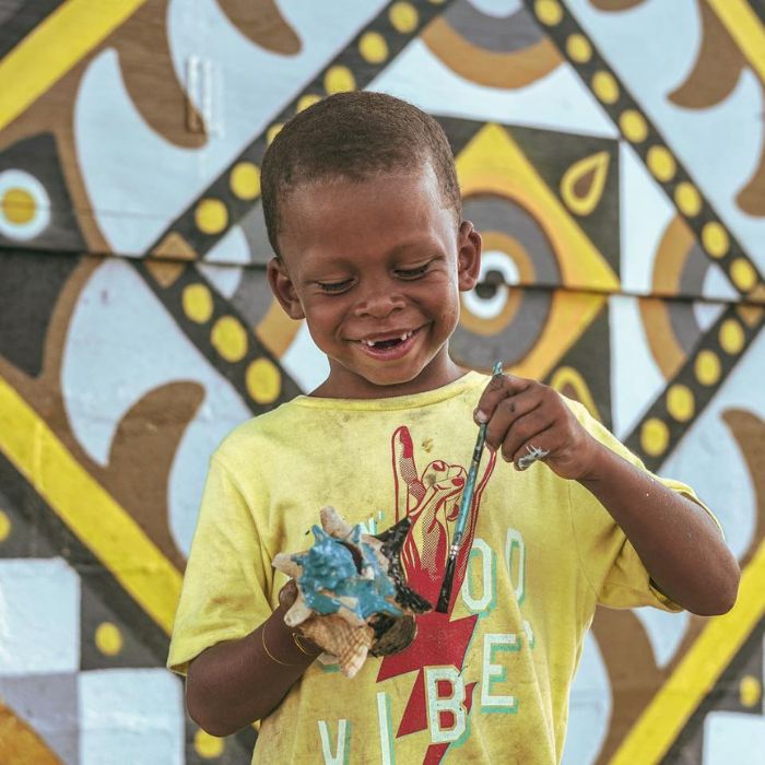 Children learning how to paint 