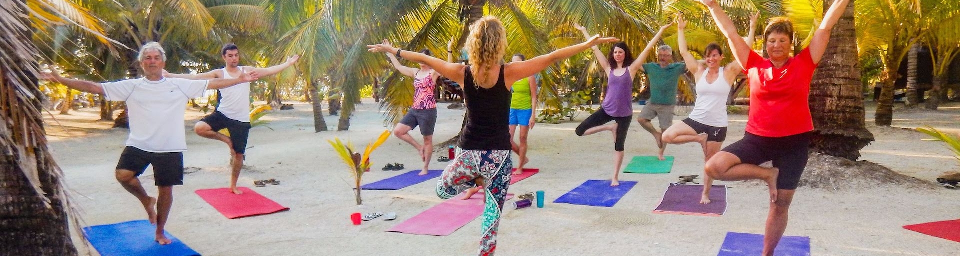 Beach yoga at Island Expeditions Glover's Reef Adventure Basecamp