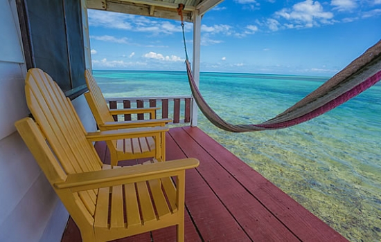 Tobacco Caye Paradise - Cabanas over the water