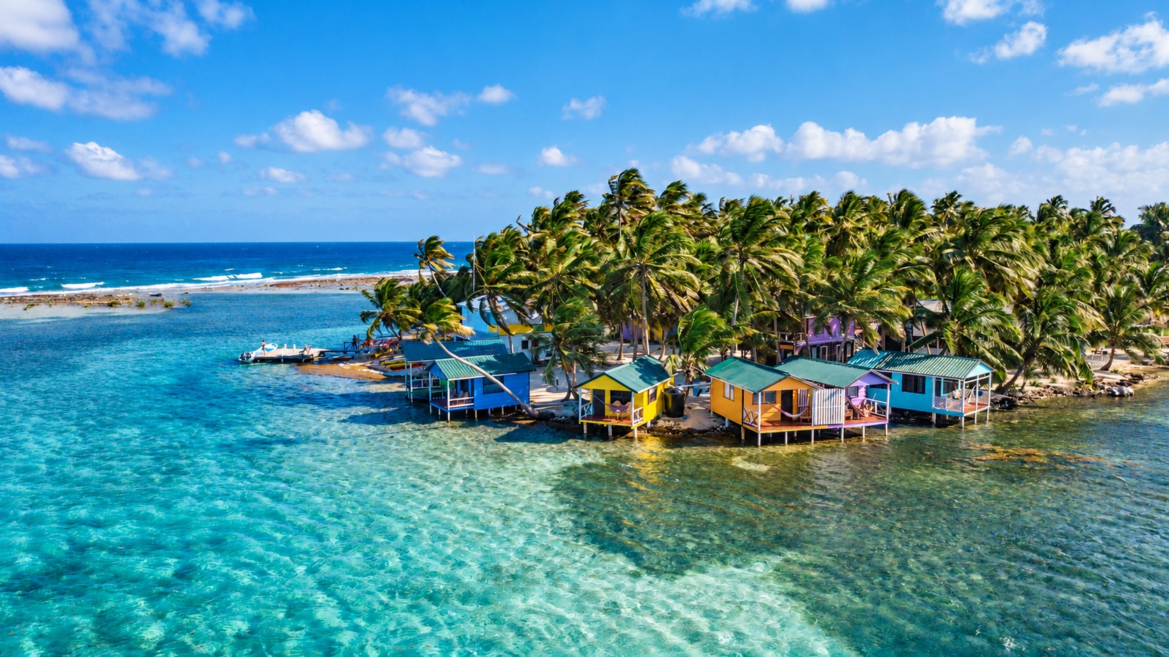 View of over-water cabanas at Tobacco Caye, Belize