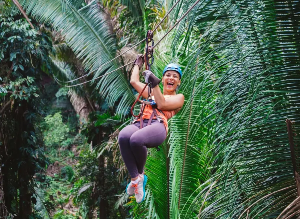Person enjoying a zipline adventure at Bocawina in Belize