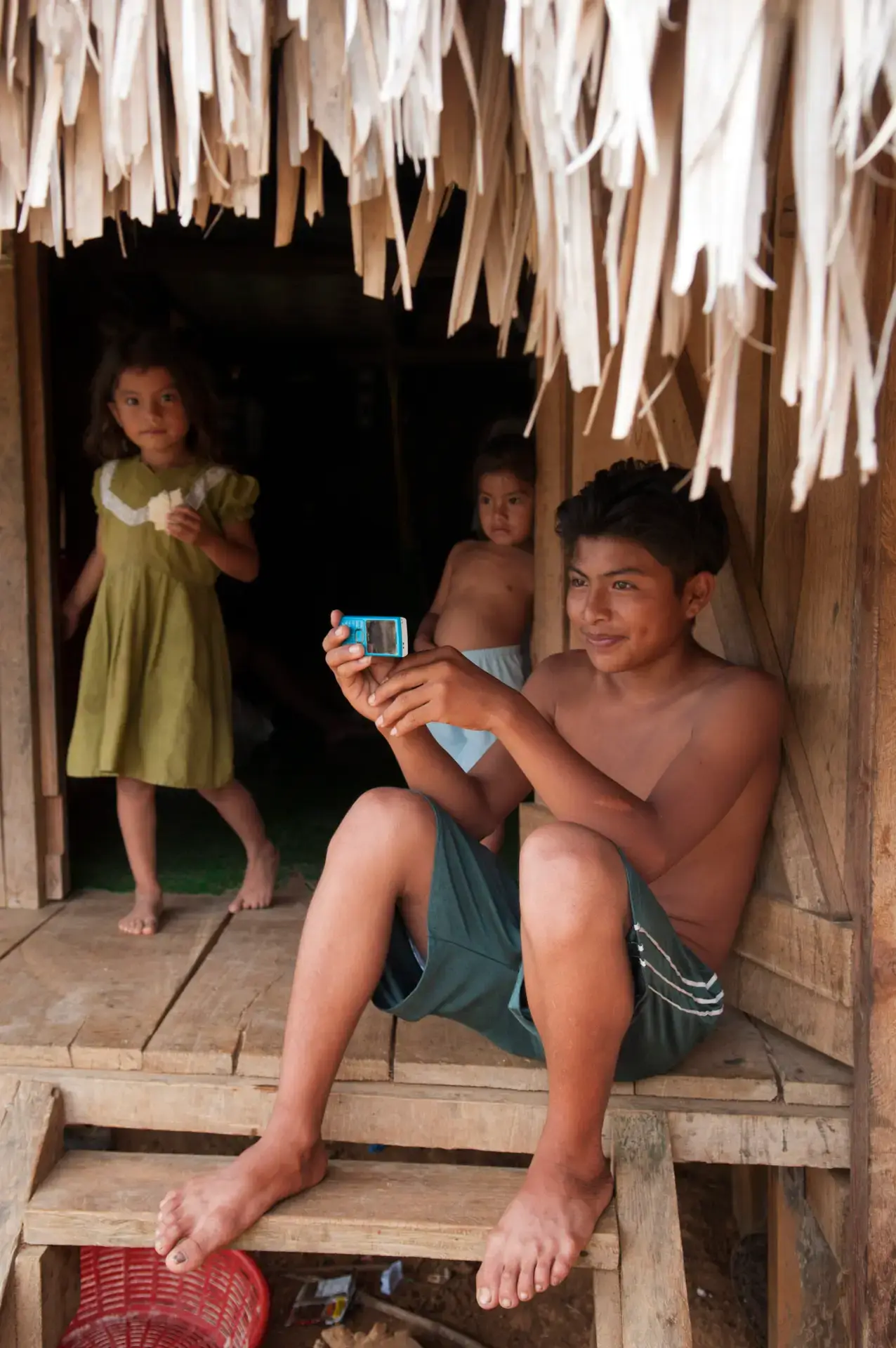 Maya children relaxing at their home in the village of Santa Teresa in Belize